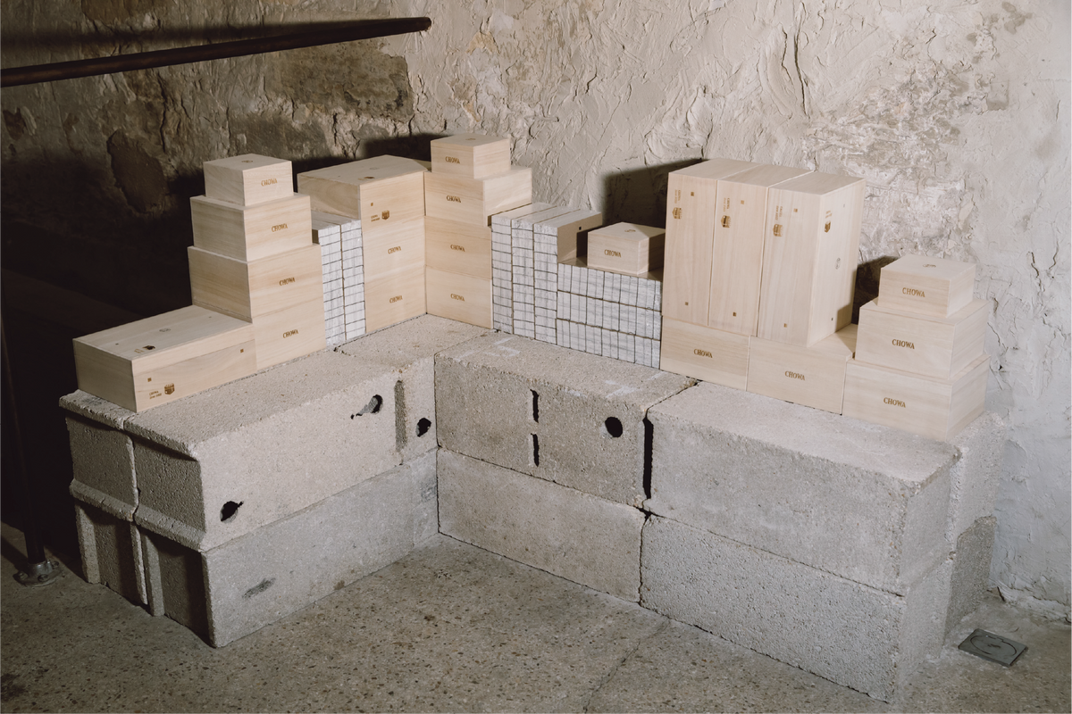 A finished box being looked over outside the workshop