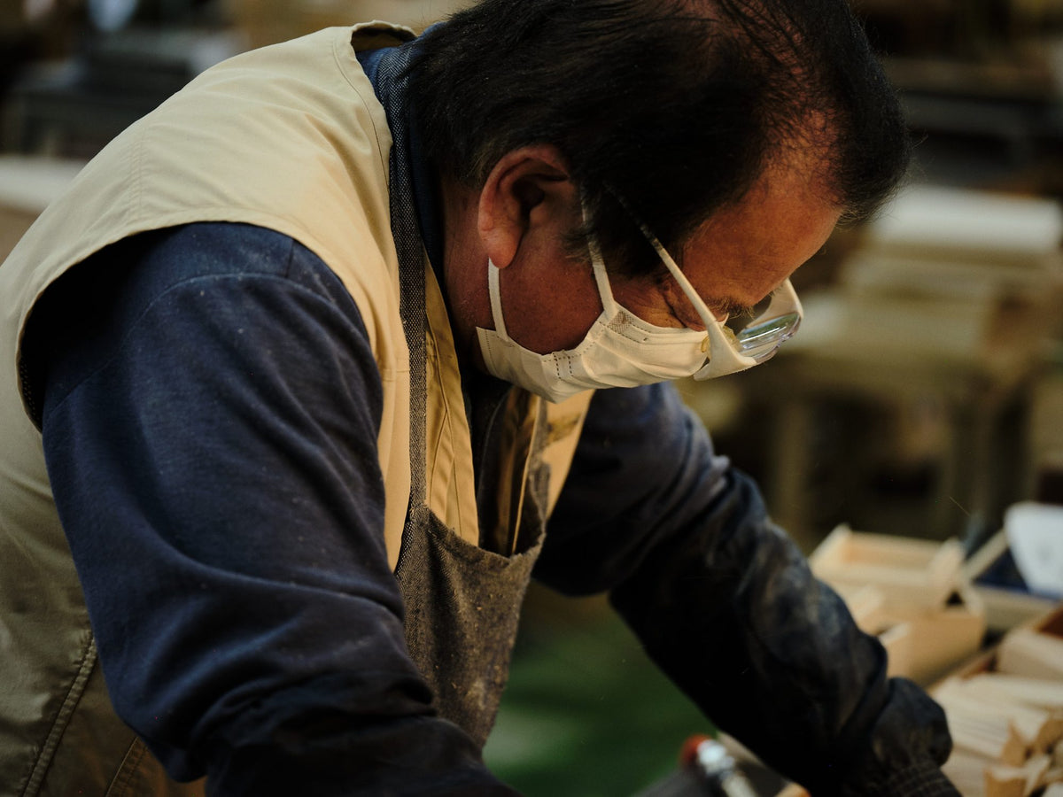 A craftsman working, close in profile