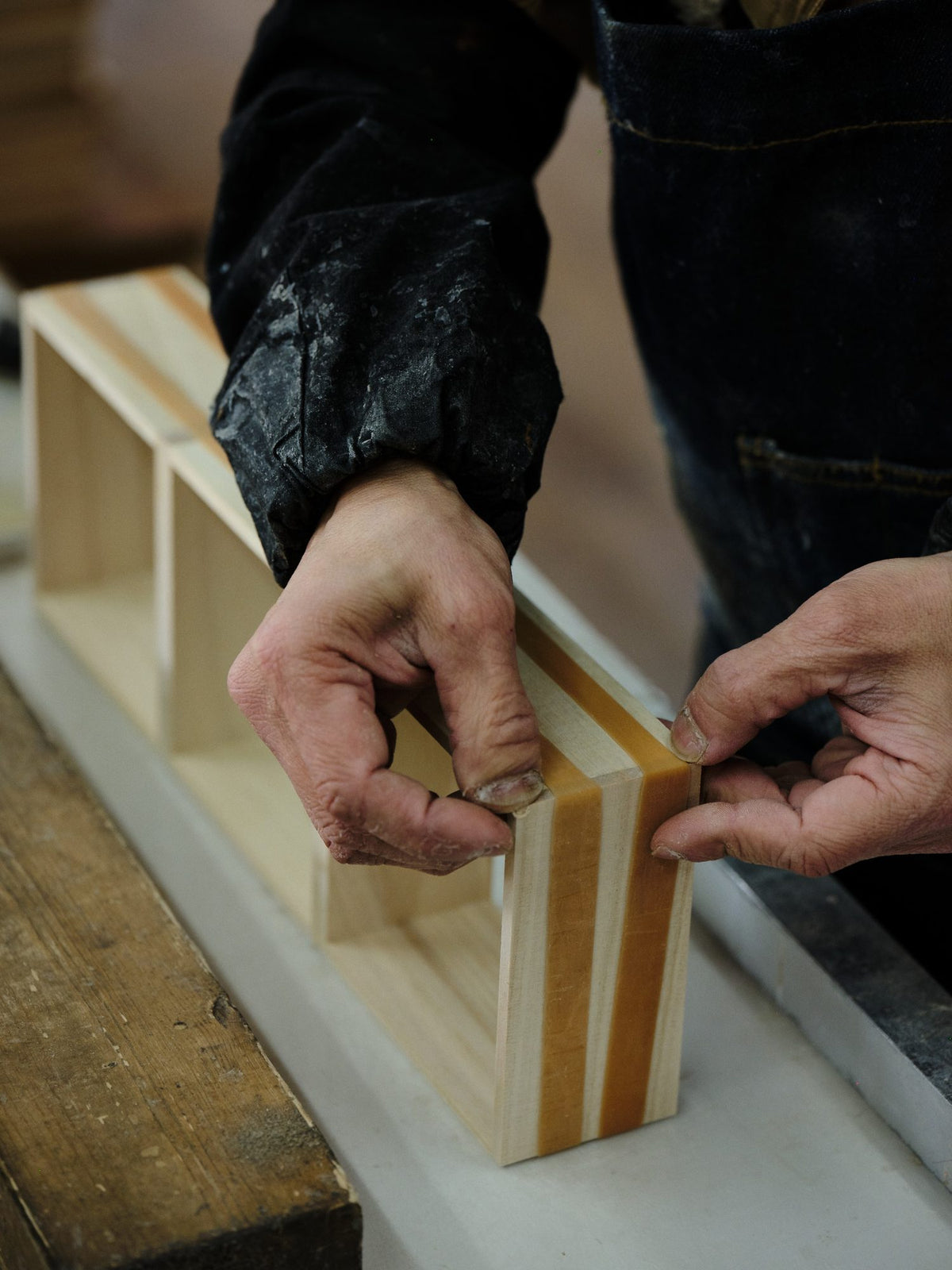 A craftsman at the bench, in profile